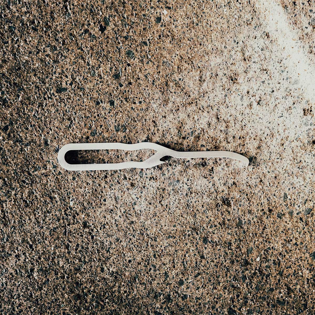 Trusten The Mini Priser – Compact & Efficient Stainless steel on ground