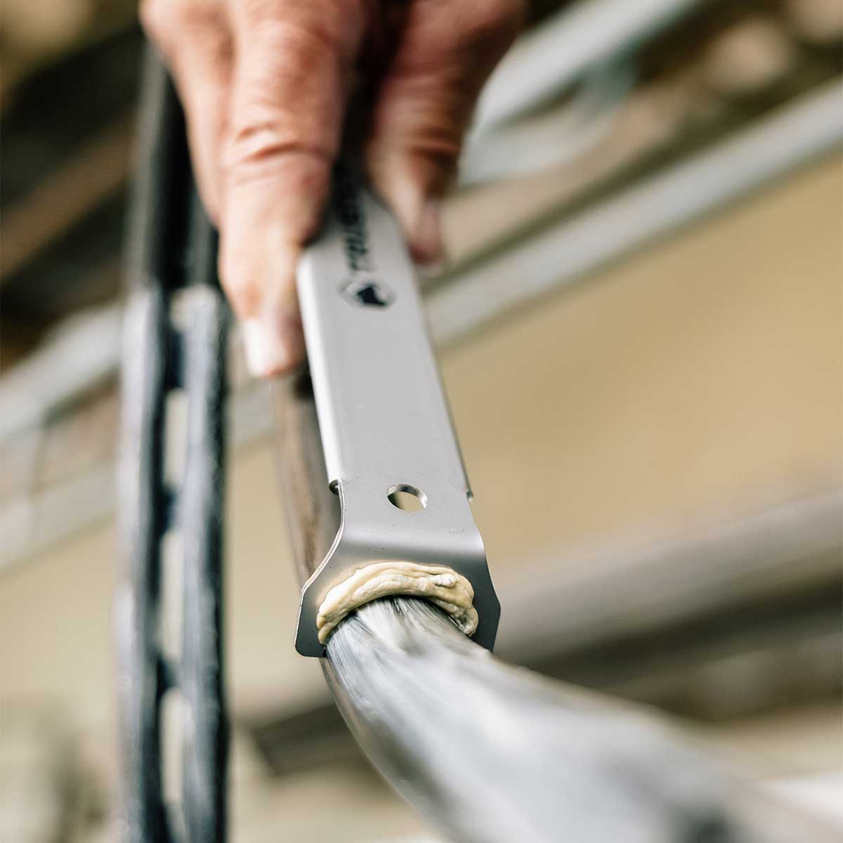 Trusten The Scraper Tool – Simplify Shed Hygiene in use