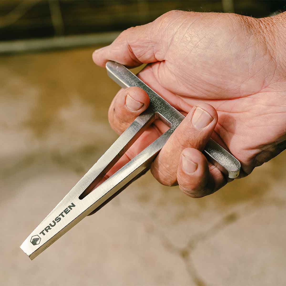 Trusten Trough Wedger held in hand