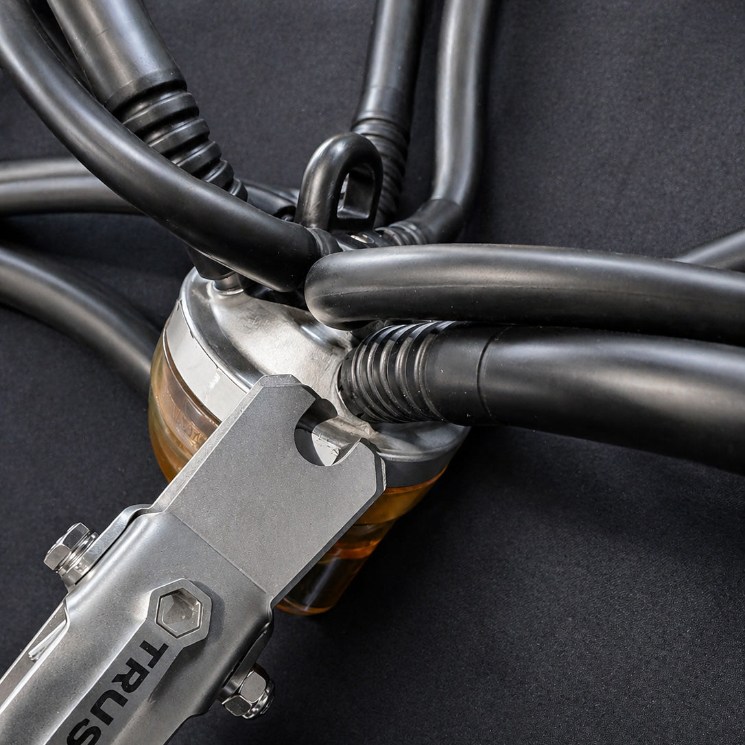 Close-up of inflation releaser tool read to remove inflation valve